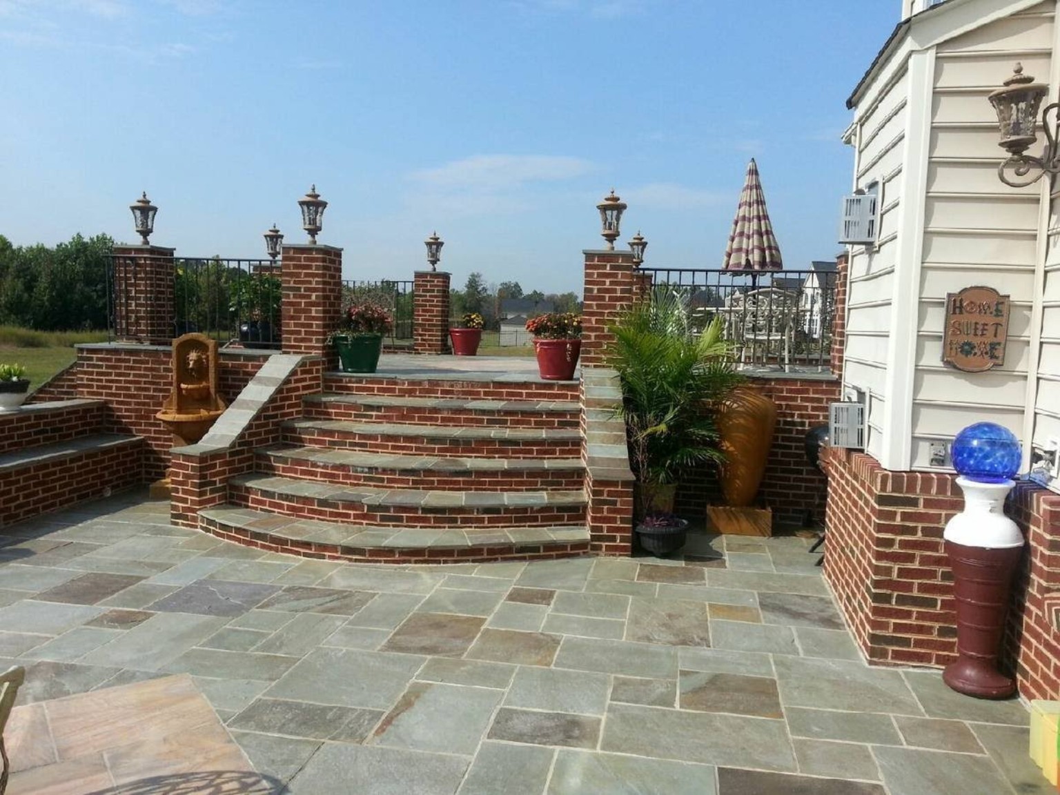 Brick raised patio with stone steps