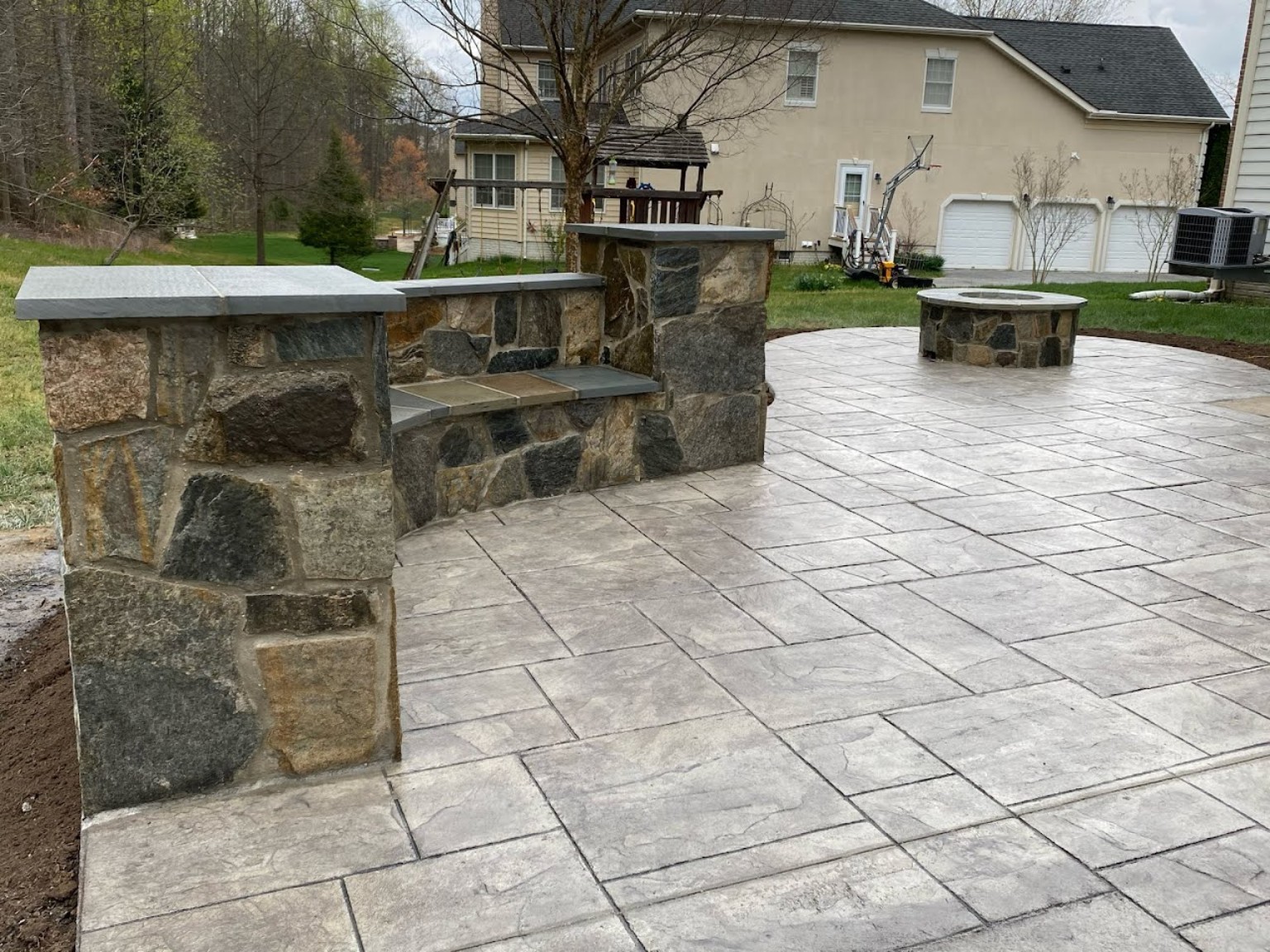 Stamped concrete patio with seating wall